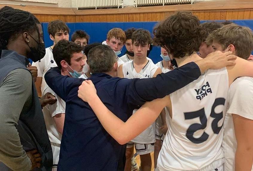 Boys Basketball team huddle